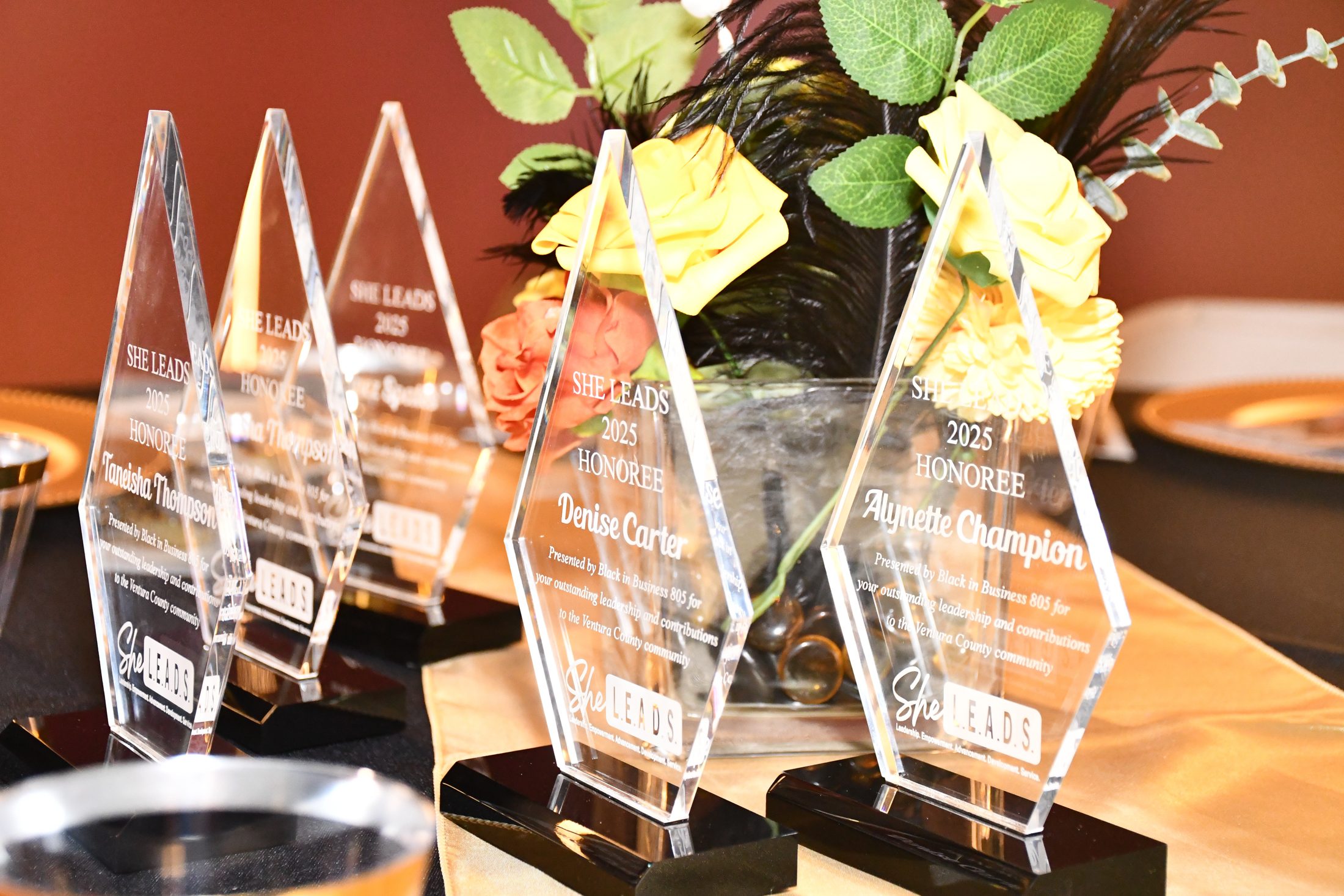 Honorees celebrating on stage at the 2025 She Leads Ventura County awards dinner